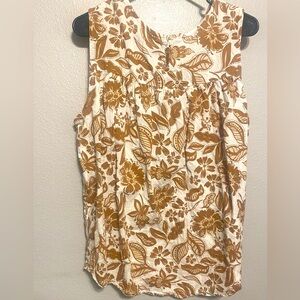 Really cute Brown & White Floral/Paisley-ish sleeveless shirt. One button V-Veck
